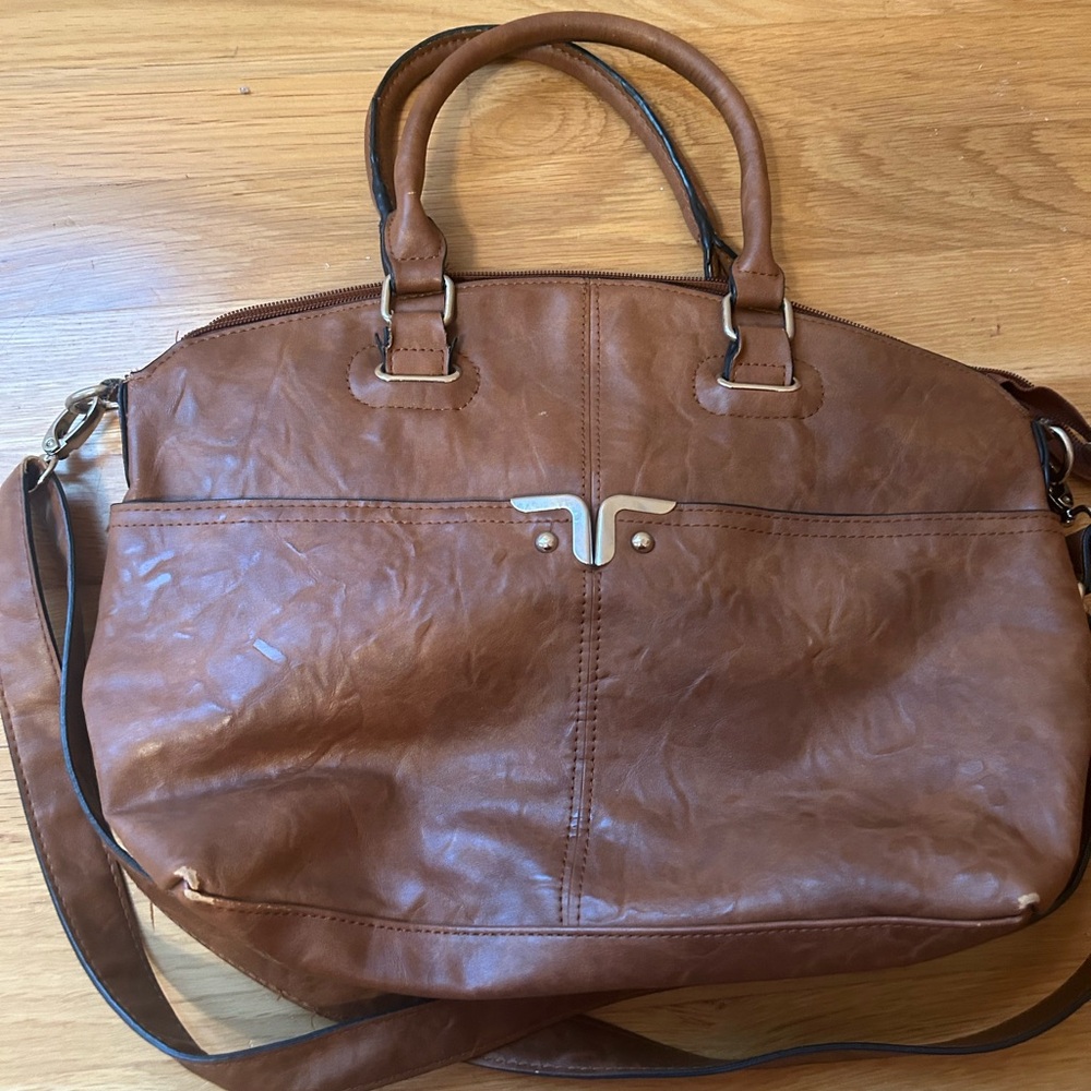 Great handbag. Has been used but in great shape.